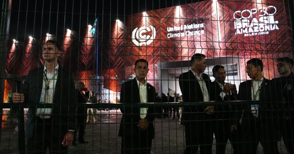Protesters confront security at main venue of UN climate talks